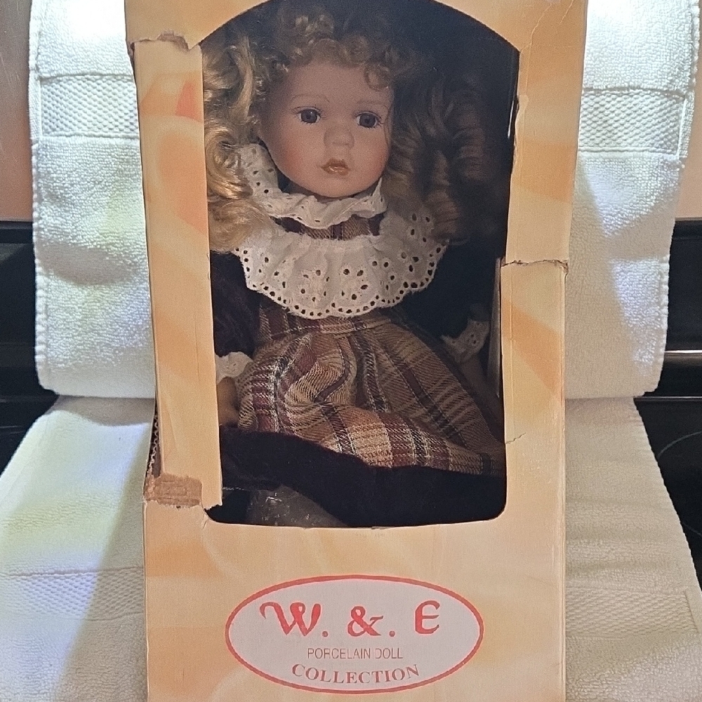 Porcelain Doll with Blonde Curls and Plaid Dress